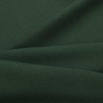 Ткань костюмная 21010 2076, 225 гр/м2, шир.150см, цвет т.зеленый - купить в Евпатории. Цена 394.71 руб.